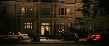 Movie still from “The Walker” (2007), directed by Paul Schrader – A car parked on the side of the street at night; Extreme Wide shot, Low angle