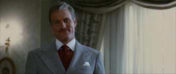 Movie still from “The Walker” (2007), directed by Paul Schrader – A person wearing a suit and tie; Close Up shot, Low angle