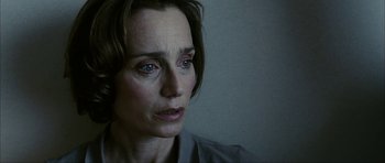 Movie still from “The Walker” (2007), directed by Paul Schrader – A person looking sad; Close Up shot, High angle