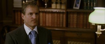 Movie still from “The Walker” (2007), directed by Paul Schrader – A person wearing a suit and tie; Close Up shot, Low angle