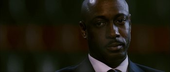 Movie still from “The Walker” (2007), directed by Paul Schrader – A person wearing a suit and tie; Close Up shot, Low angle