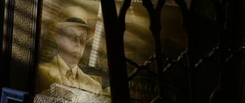 Movie still from “The Walker” (2007), directed by Paul Schrader – An image of an old man wearing a hat and glasses; Extreme Close Up shot, Low angle