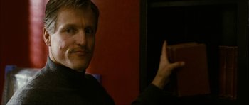Movie still from “The Walker” (2007), directed by Paul Schrader – A person with a mustache holding a cup; Close Up shot, Low angle