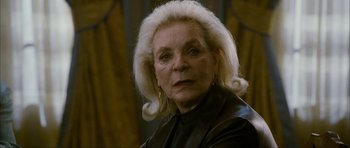 Movie still from “The Walker” (2007), directed by Paul Schrader – An older woman with blonde hair wearing a leather jacket; Close Up shot, Low angle