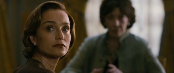 Movie still from “The Walker” (2007), directed by Paul Schrader – A person sitting in front of another person; Close Up shot, Over the shoulder angle