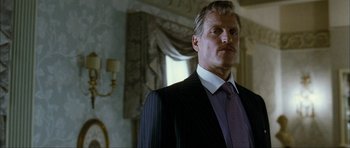 Movie still from “The Walker” (2007), directed by Paul Schrader – A person wearing a suit and tie; Close Up shot, Low angle