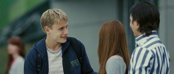 Movie still from “The Wave” (2008), directed by Dennis Gansel – A man and a woman talking to each other; Medium shot, Over the shoulder angle