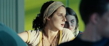 Movie still from “The Wave” (2008), directed by Dennis Gansel – A young woman with a bandana on her head; Close Up shot, Over the shoulder angle