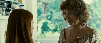 Movie still from “The Wave” (2008), directed by Dennis Gansel – A woman talking to another woman in front of a window; Close Up shot, Over the shoulder angle