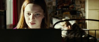 Movie still from “The Wave” (2008), directed by Dennis Gansel – A woman sitting in front of a laptop computer; Close Up shot, Over the shoulder angle