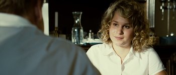 Movie still from “The Wave” (2008), directed by Dennis Gansel – A woman sitting in front of a man in front of a table; Close Up shot, Over the shoulder angle