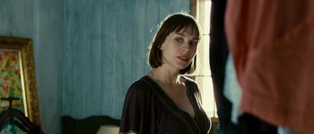 Movie still from “The Wave” (2008), directed by Dennis Gansel – A woman with short hair wearing a black dress; Close Up shot, Over the shoulder angle