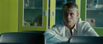 Movie still from “The Wave” (2008), directed by Dennis Gansel – A man sitting in front of a computer monitor; Close Up shot, Over the shoulder angle