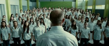 Movie still from “The Wave” (2008), directed by Dennis Gansel – A group of people standing in front of each other; Wide shot, Over the shoulder angle