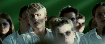Movie still from “The Wave” (2008), directed by Dennis Gansel – A group of young men standing next to each other; Close Up shot, Over the shoulder angle