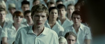 Movie still from “The Wave” (2008), directed by Dennis Gansel – A group of young men standing next to each other; Close Up shot, Over the shoulder angle