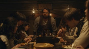 Movie still from “Anne with an E” (2017), created by Moira Walley-Beckett – A group of people sitting around a table; Medium shot, Over the shoulder angle