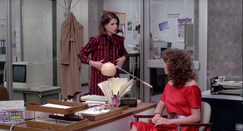 Two women in a room talking to each other