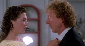 Movie still from “The Woman in Red” (1984), directed by Gene Wilder – A man and a woman looking at each other; Close Up shot, Over the shoulder angle
