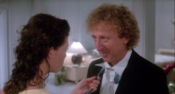 Movie still from “The Woman in Red” (1984), directed by Gene Wilder – A man and a woman are talking to each other; Close Up shot, Over the shoulder angle
