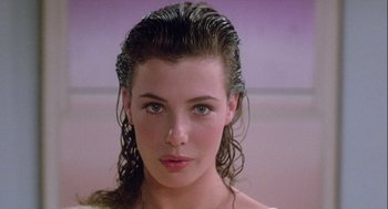 Movie still from “The Woman in Red” (1984), directed by Gene Wilder – A person with wet hair; Close Up shot, Over the shoulder angle