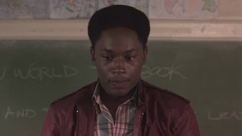 Movie still from “The Wood” (1999), directed by Rick Famuyiwa – A young man in front of a chalkboard; Close Up shot, High angle