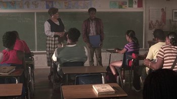 Movie still from “The Wood” (1999), directed by Rick Famuyiwa – A group of people sitting in a classroom; Wide shot, Over the shoulder angle