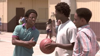 Movie still from “The Wood” (1999), directed by Rick Famuyiwa – A group of young men standing next to each other holding a basketball; Close Up shot, Low angle