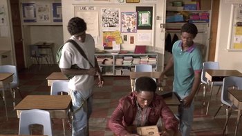 Movie still from “The Wood” (1999), directed by Rick Famuyiwa – A group of people standing in a room; Medium shot, High angle
