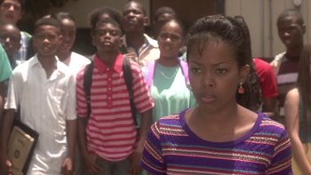Movie still from “The Wood” (1999), directed by Rick Famuyiwa – A group of people standing in a line; Close Up shot, High angle
