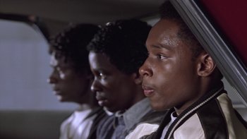 Movie still from “The Wood” (1999), directed by Rick Famuyiwa – A group of young men standing next to each other; Close Up shot, Low angle