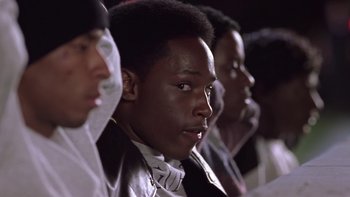 Movie still from “The Wood” (1999), directed by Rick Famuyiwa – A group of young men standing next to each other; Close Up shot, Low angle