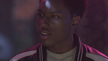 Movie still from “The Wood” (1999), directed by Rick Famuyiwa – A person wearing a jacket; Close Up shot, Over the shoulder angle