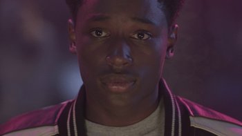 Movie still from “The Wood” (1999), directed by Rick Famuyiwa – A person wearing a jacket; Close Up shot, Over the shoulder angle