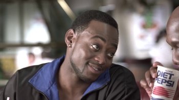 Movie still from “The Wood” (1999), directed by Rick Famuyiwa – A person wearing a jacket; Close Up shot, High angle