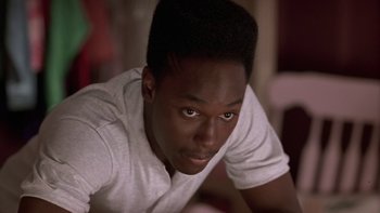 Movie still from “The Wood” (1999), directed by Rick Famuyiwa – A young man is looking into the camera; Close Up shot, Low angle