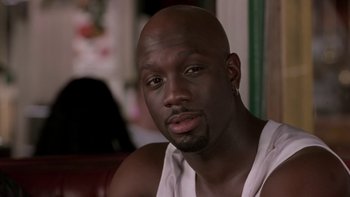 Movie still from “The Wood” (1999), directed by Rick Famuyiwa – A person wearing a white shirt; Close Up shot, High angle