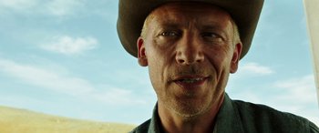 Movie still from “The Young and Prodigious T.S. Spivet” (2013), directed by Jean-Pierre Jeunet – A person wearing a cowboy hat; Close Up shot, Low angle
