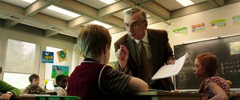Movie still from “The Young and Prodigious T.S. Spivet” (2013), directed by Jean-Pierre Jeunet – An older man and a young boy talking to each other; Medium shot, Over the shoulder angle