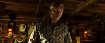 Movie still from “The Young and Prodigious T.S. Spivet” (2013), directed by Jean-Pierre Jeunet – A person wearing a plaid shirt; Close Up shot, Low angle