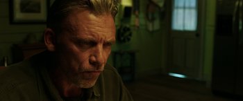 Movie still from “The Young and Prodigious T.S. Spivet” (2013), directed by Jean-Pierre Jeunet – A person looking at the camera; Close Up shot, Low angle