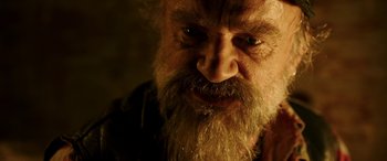 Movie still from “The Young and Prodigious T.S. Spivet” (2013), directed by Jean-Pierre Jeunet – An old man with a long beard looking at the camera; Close Up shot, Over the shoulder angle