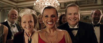 Movie still from “The Young and Prodigious T.S. Spivet” (2013), directed by Jean-Pierre Jeunet – A group of people standing in a room; Close Up shot, Low angle