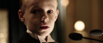 Movie still from “The Young and Prodigious T.S. Spivet” (2013), directed by Jean-Pierre Jeunet – A young boy wearing a black bow tie; Close Up shot, Over the shoulder angle