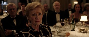 Movie still from “The Young and Prodigious T.S. Spivet” (2013), directed by Jean-Pierre Jeunet – An older woman sitting in front of a dinner table; Close Up shot, Over the shoulder angle