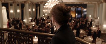 Movie still from “The Young and Prodigious T.S. Spivet” (2013), directed by Jean-Pierre Jeunet – A woman is looking out over a crowd of onlookers at an event; Medium shot, High angle