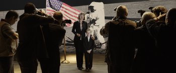 Movie still from “The Young and Prodigious T.S. Spivet” (2013), directed by Jean-Pierre Jeunet – A woman and a boy standing in front of an image of the moon; Wide shot, Over the shoulder angle