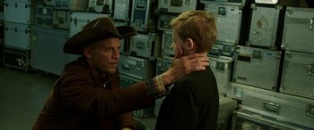 Movie still from “The Young and Prodigious T.S. Spivet” (2013), directed by Jean-Pierre Jeunet – A man and a boy are touching each other's neck; Medium shot, Over the shoulder angle