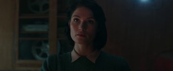 Movie still from “Their Finest” (2016), directed by Lone Scherfig – A person wearing a sweater; Close Up shot, Low angle