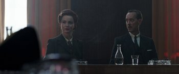 Movie still from “Their Finest” (2016), directed by Lone Scherfig – A man and a woman sitting in front of a mirror; Medium shot, Low angle